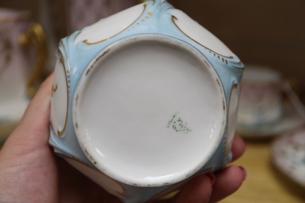 A Limoges porcelain part coffee service, with floral decoration heightened in gilt (9 pieces), coffee pot H.23cm